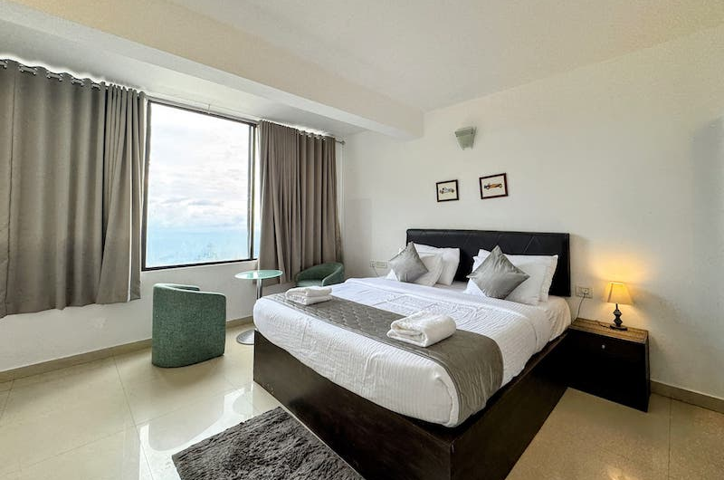 Elegant Royal Bedroom of The Vue Munnar Retreat Resort in Munnar With Cozy Interiors