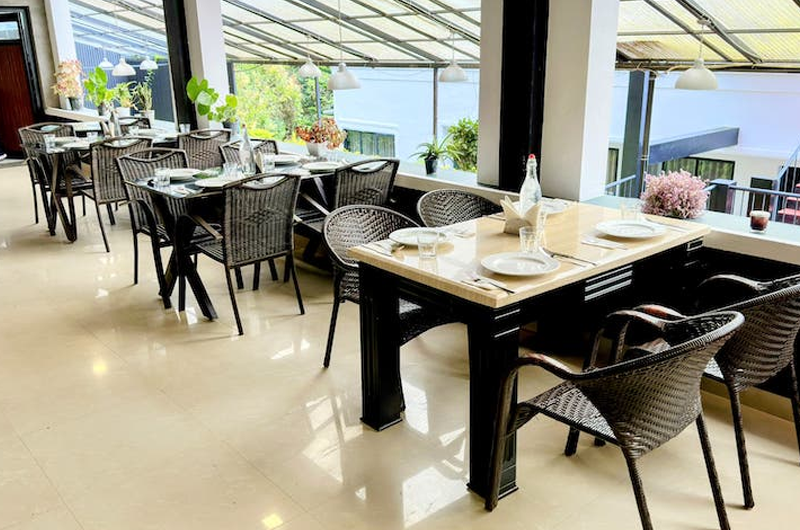 Restaurant of The Vue Munnar Retreat Resort in Munnar with Elegant Dining Ambiance