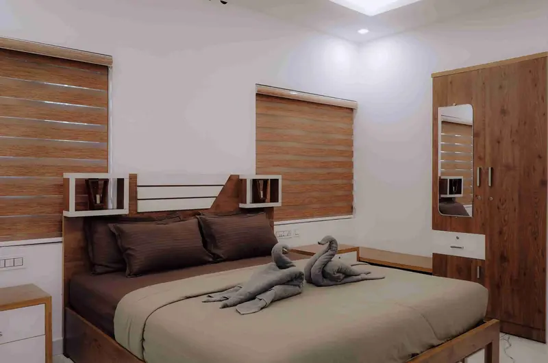 Well-furnished bedroom interior at Kalt Munnar Homestay