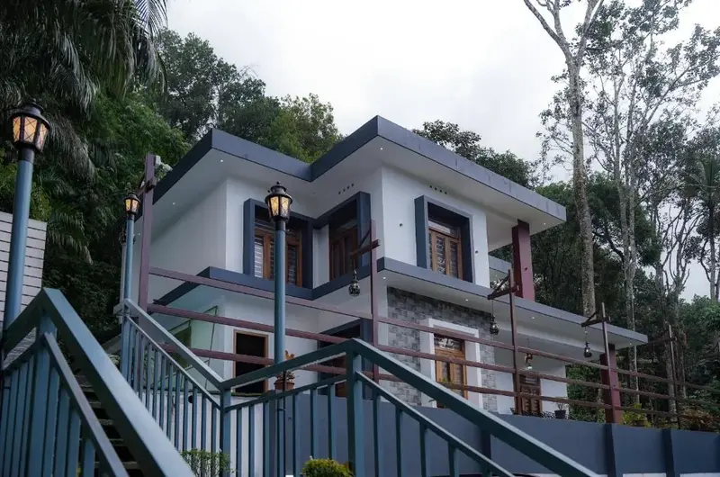Peaceful exterior setting with warm visual appeal at Kalt Munnar Homestay