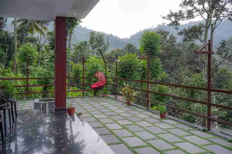 Scenic front exterior surrounded by peaceful surroundings at Kalt Munnar Homestay