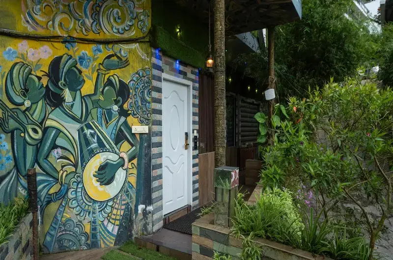 Artistic cottage entrance at Pool Villas By Parakkat Nature Hotel And Resorts
