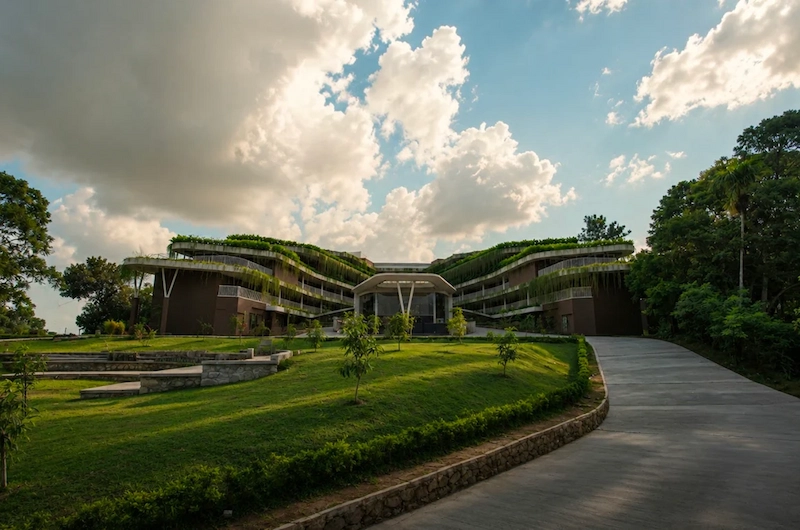 Luxury hilltop resort architecture surrounded by forests and valleys at Mountree Munnar