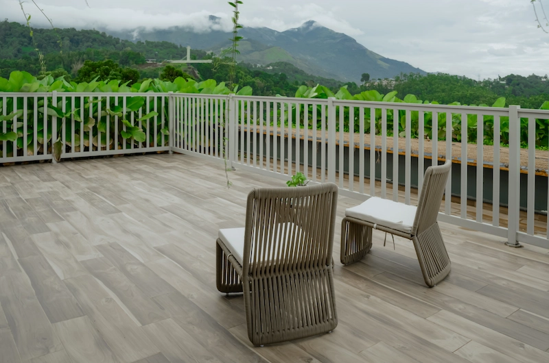 Private balcony deck with scenic valley view at Mountree Munnar