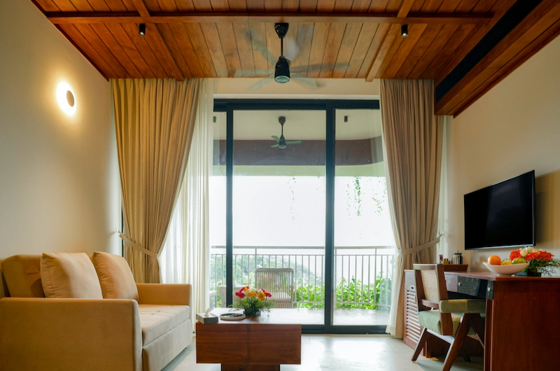 Cozy living area interior inside luxury suite at Mountree Munnar