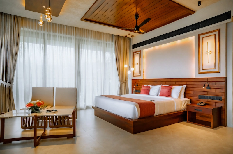 Comfortable double bed room setup with warm ambient lighting at Mountree Munnar