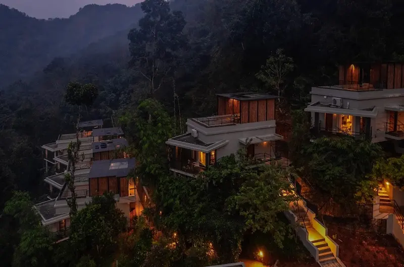 Illuminated resort pathways and luxury stay options at Maram Resort Mamalakandam