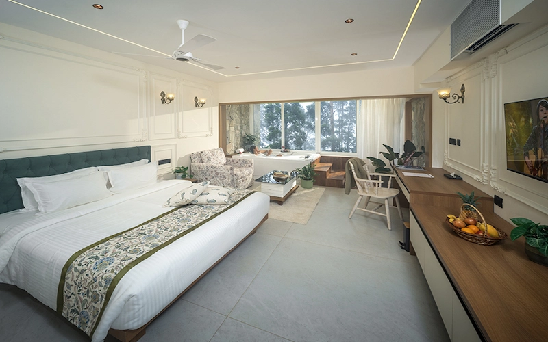 Spacious guest suite with plush king bed at 1924 Clock House Resort Munnar