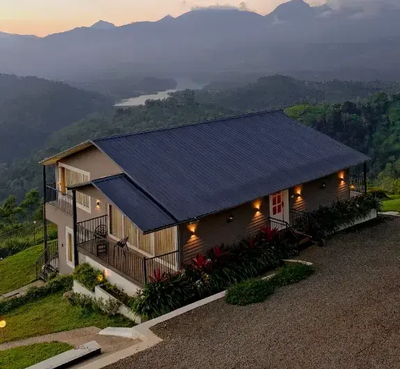 Sloped roof eco cottage built on elevated mountain terrain in Wild Lilly