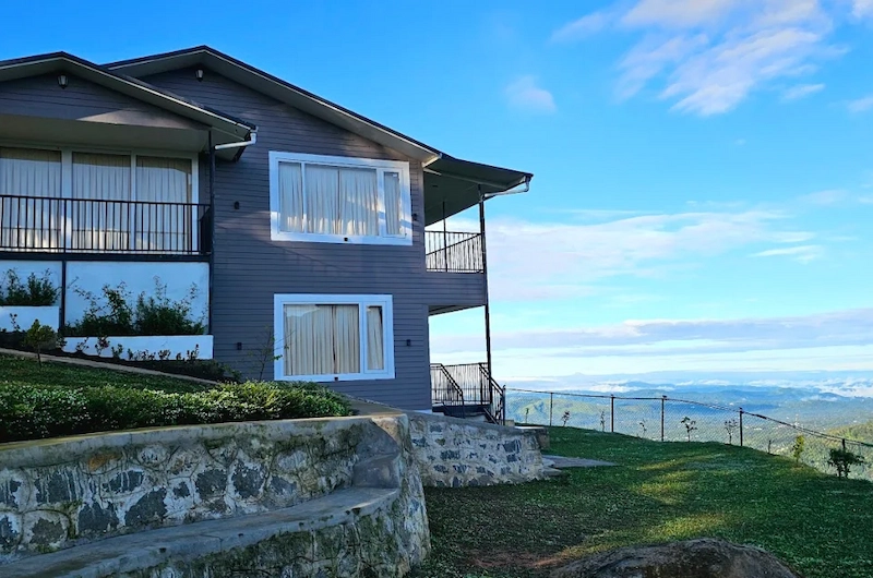 Modern eco resort building overlooking scenic mountain landscape at Wild Lilly