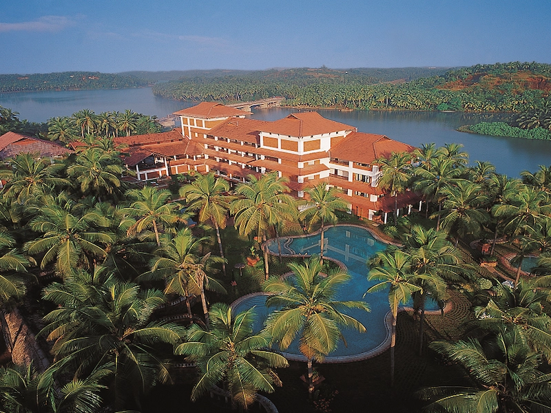 Scenic aerial view of eco-resort property and green palm groves near backwaters at Raviz Kadavu